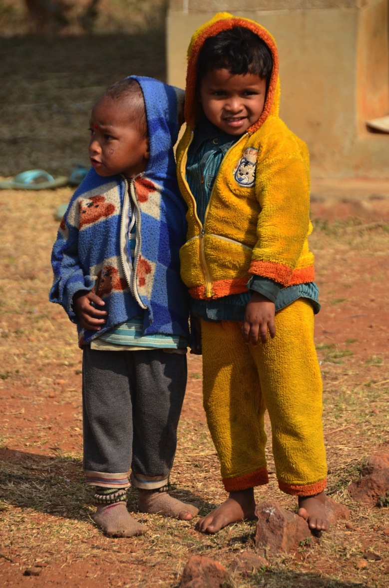 Two village school students wearing warm winter clothing