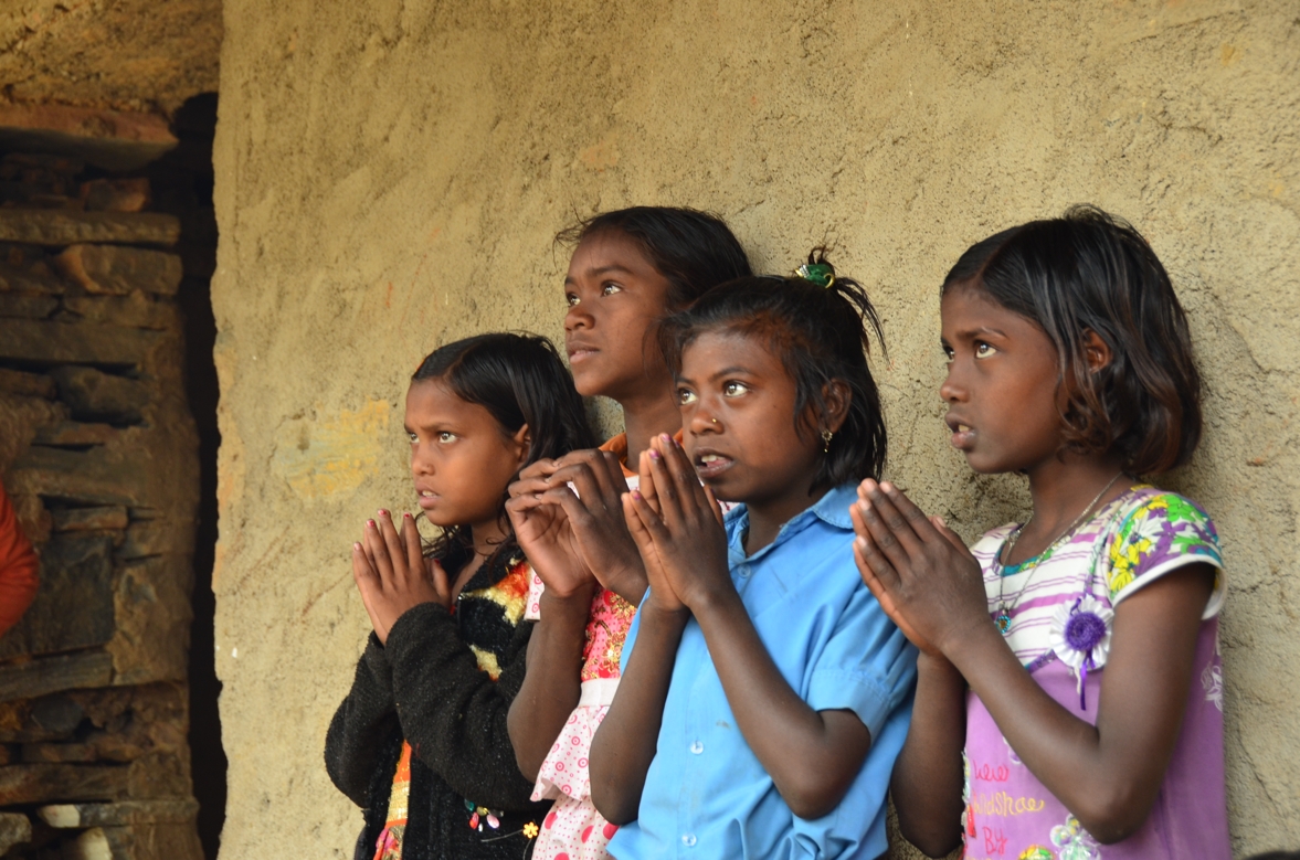 Village school students participating in a quiet reflective activity