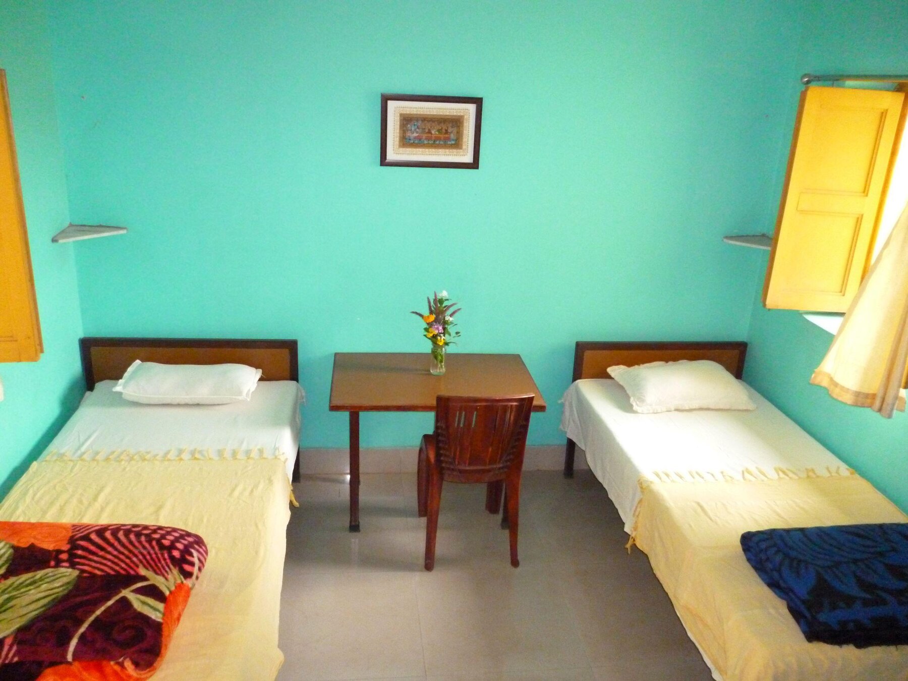 A clean twin bedroom for residential guests at the treatment centre