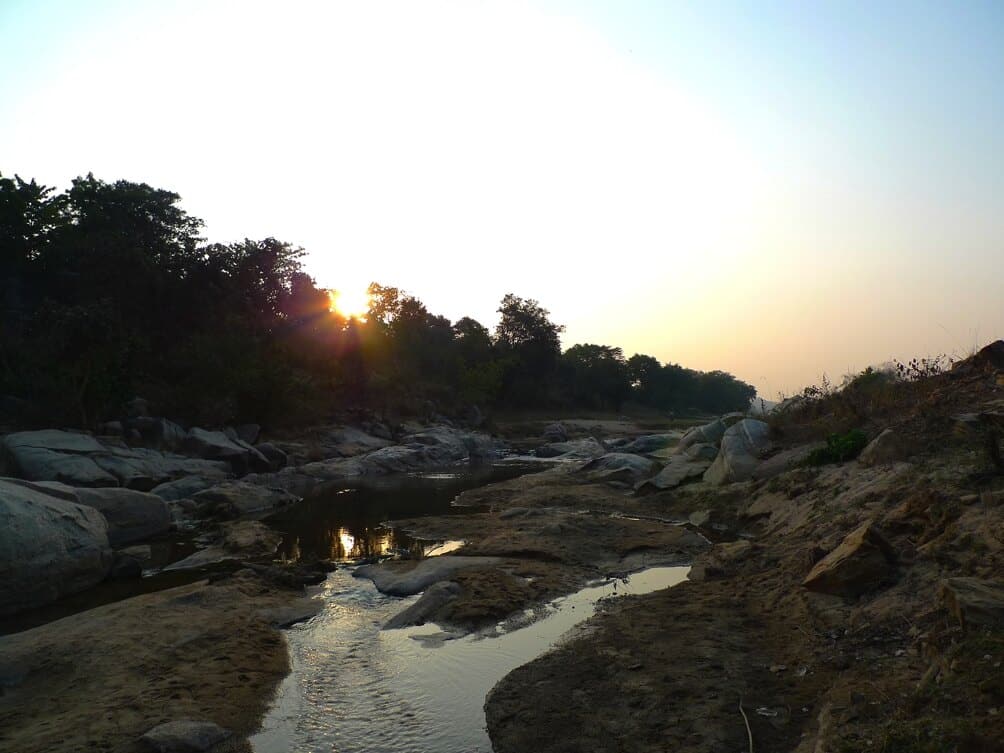 Rocky stream at sunset Sunset over a rocky stream in the Ánanda Nagar landscape